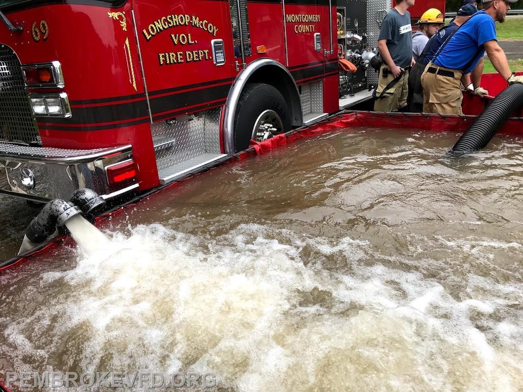 Drop tank being used as a water source to be able to fight fires