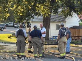 Firefighter Jay Meadows instructs new members what he learned recently in a truck operations class.